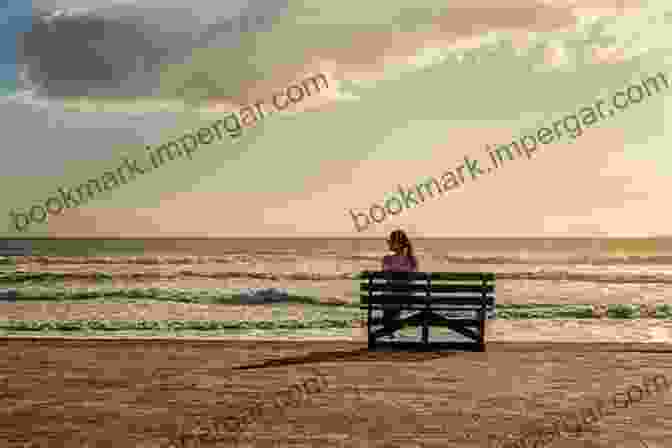 A Woman Sitting On A Bench Looking Out At The Ocean, With The Words 'Back To Reality' Written In The Sand BACK TO REALITY Laura Lee Hope